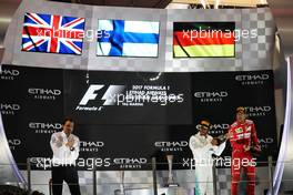 (L to R): Lewis Hamilton (GBR) Mercedes AMG F1 celebrates his second position on the podium with third placed Sebastian Vettel (GER) Ferrari. 26.11.2017. Formula 1 World Championship, Rd 20, Abu Dhabi Grand Prix, Yas Marina Circuit, Abu Dhabi, Race Day.