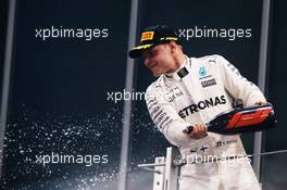 Race winner Valtteri Bottas (FIN) Mercedes AMG F1 celebrates on the podium. 26.11.2017. Formula 1 World Championship, Rd 20, Abu Dhabi Grand Prix, Yas Marina Circuit, Abu Dhabi, Race Day.