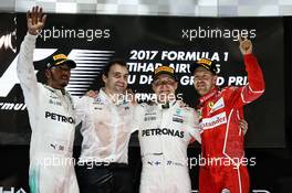 The podium (L to R): Lewis Hamilton (GBR) Mercedes AMG F1, second; Valtteri Bottas (FIN) Mercedes AMG F1, race winner; Sebastian Vettel (GER) Ferrari, third. 26.11.2017. Formula 1 World Championship, Rd 20, Abu Dhabi Grand Prix, Yas Marina Circuit, Abu Dhabi, Race Day.
