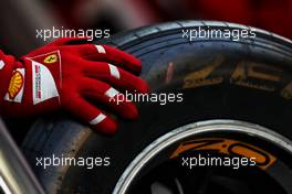 Ferrari mechanic with Pirelli tyre.