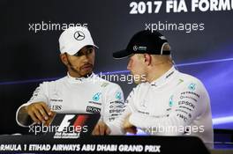(L to R): Lewis Hamilton (GBR) Mercedes AMG F1 and team mate Valtteri Bottas (FIN) Mercedes AMG F1 in the FIA Press Conference. 25.11.2017. Formula 1 World Championship, Rd 20, Abu Dhabi Grand Prix, Yas Marina Circuit, Abu Dhabi, Qualifying Day.