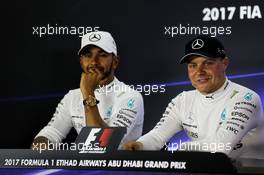 (L to R): Lewis Hamilton (GBR) Mercedes AMG F1 and team mate Valtteri Bottas (FIN) Mercedes AMG F1 in the FIA Press Conference. 25.11.2017. Formula 1 World Championship, Rd 20, Abu Dhabi Grand Prix, Yas Marina Circuit, Abu Dhabi, Qualifying Day.