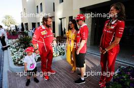 Kimi Raikkonen (FIN) Ferrari with wife Minttu Raikkonen (FIN), son Robin, Gino Rosato (CDN) Ferrari, and Stefania Bocchi (ITA) Ferrari Press Officer. 25.11.2017. Formula 1 World Championship, Rd 20, Abu Dhabi Grand Prix, Yas Marina Circuit, Abu Dhabi, Qualifying Day.