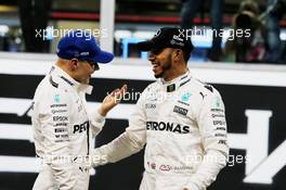 (L to R): Valtteri Bottas (FIN) Mercedes AMG F1 celebrates his pole position with team mate Lewis Hamilton (GBR) Mercedes AMG F1 in qualifying parc ferme. 25.11.2017. Formula 1 World Championship, Rd 20, Abu Dhabi Grand Prix, Yas Marina Circuit, Abu Dhabi, Qualifying Day.