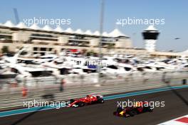 Sebastian Vettel (GER) Ferrari SF70H and Max Verstappen (NLD) Red Bull Racing RB13. 25.11.2017. Formula 1 World Championship, Rd 20, Abu Dhabi Grand Prix, Yas Marina Circuit, Abu Dhabi, Qualifying Day.