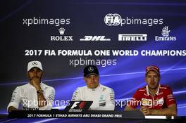 The post qualifying FIA Press Conference (L to R): Sebastian Vettel (GER) Ferrari, second; Valtteri Bottas (FIN) Mercedes AMG F1, pole position; Lewis Hamilton (GBR) Mercedes AMG F1, third. 25.11.2017. Formula 1 World Championship, Rd 20, Abu Dhabi Grand Prix, Yas Marina Circuit, Abu Dhabi, Qualifying Day.