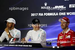 The post qualifying FIA Press Conference (L to R): Sebastian Vettel (GER) Ferrari, second; Valtteri Bottas (FIN) Mercedes AMG F1, pole position; Lewis Hamilton (GBR) Mercedes AMG F1, third. 25.11.2017. Formula 1 World Championship, Rd 20, Abu Dhabi Grand Prix, Yas Marina Circuit, Abu Dhabi, Qualifying Day.