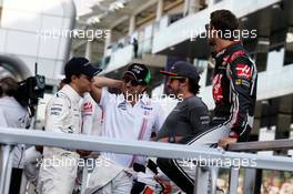 (L to R): Felipe Massa (BRA) Williams on the drivers parade with Sergio Perez (MEX) Sahara Force India F1; Fernando Alonso (ESP) McLaren; and Romain Grosjean (FRA) Haas F1 Team. 26.11.2017. Formula 1 World Championship, Rd 20, Abu Dhabi Grand Prix, Yas Marina Circuit, Abu Dhabi, Race Day.
