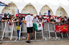 Esteban Ocon (FRA) Sahara Force India F1 Team signs autographs for the fans. 26.11.2017. Formula 1 World Championship, Rd 20, Abu Dhabi Grand Prix, Yas Marina Circuit, Abu Dhabi, Race Day.