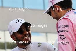 (L to R): Lewis Hamilton (GBR) Mercedes AMG F1 with Esteban Ocon (FRA) Sahara Force India F1 Team on the drivers parade. 26.11.2017. Formula 1 World Championship, Rd 20, Abu Dhabi Grand Prix, Yas Marina Circuit, Abu Dhabi, Race Day.