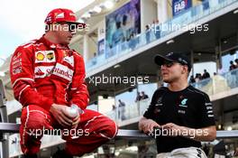 (L to R): Kimi Raikkonen (FIN) Ferrari with Valtteri Bottas (FIN) Mercedes AMG F1 on the drivers parade. 26.11.2017. Formula 1 World Championship, Rd 20, Abu Dhabi Grand Prix, Yas Marina Circuit, Abu Dhabi, Race Day.