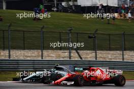 Sebastian Vettel (GER) Ferrari SF70H and Valtteri Bottas (FIN) Mercedes AMG F1 W08.                                20.10.2017. Formula 1 World Championship, Rd 17, United States Grand Prix, Austin, Texas, USA, Practice Day.
