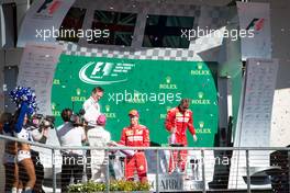 (L to R): Lewis Hamilton (GBR) Mercedes AMG F1 celebrates on the podium with Sebastian Vettel (GER) Ferrari and Kimi Raikkonen (FIN) Ferrari. 22.10.2017. Formula 1 World Championship, Rd 17, United States Grand Prix, Austin, Texas, USA, Race Day.