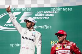 (L to R): Race winner Lewis Hamilton (GBR) Mercedes AMG F1 celebrates on the podium with Kimi Raikkonen (FIN) Ferrari. 22.10.2017. Formula 1 World Championship, Rd 17, United States Grand Prix, Austin, Texas, USA, Race Day.