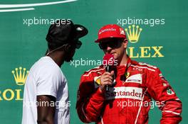 (L to R): Usain Bolt (JAM) Athlete with Kimi Raikkonen (FIN) Ferrari on the podium. 22.10.2017. Formula 1 World Championship, Rd 17, United States Grand Prix, Austin, Texas, USA, Race Day.