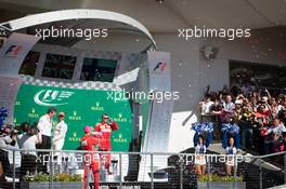 (L to R): Lewis Hamilton (GBR) Mercedes AMG F1 celebrates on the podium with Sebastian Vettel (GER) Ferrari and Kimi Raikkonen (FIN) Ferrari. 22.10.2017. Formula 1 World Championship, Rd 17, United States Grand Prix, Austin, Texas, USA, Race Day.
