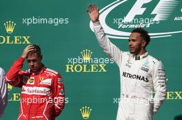 Sebastian Vettel (GER) Ferrari SF70H and 1st place Lewis Hamilton (GBR) Mercedes AMG F1. 22.10.2017. Formula 1 World Championship, Rd 17, United States Grand Prix, Austin, Texas, USA, Race Day.