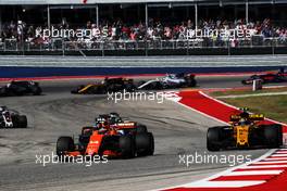 Fernando Alonso (ESP) McLaren MCL32 and Carlos Sainz Jr (ESP) Renault Sport F1 Team RS17 battle for position. 22.10.2017. Formula 1 World Championship, Rd 17, United States Grand Prix, Austin, Texas, USA, Race Day.