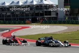 Lewis Hamilton (GBR) Mercedes AMG F1 W08 passes Sebastian Vettel (GER) Ferrari SF70H for the lead of the race. 22.10.2017. Formula 1 World Championship, Rd 17, United States Grand Prix, Austin, Texas, USA, Race Day.