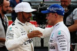 Lewis Hamilton (GBR) Mercedes AMG F1 celebrates his pole position in qualifying parc ferme with team mate Valtteri Bottas (FIN) Mercedes AMG F1. 21.10.2017. Formula 1 World Championship, Rd 17, United States Grand Prix, Austin, Texas, USA, Qualifying Day.
