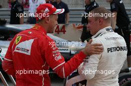 Sebastian Vettel (GER) Ferrari SF70H and Valtteri Bottas (FIN) Mercedes AMG F1 W08. 21.10.2017. Formula 1 World Championship, Rd 17, United States Grand Prix, Austin, Texas, USA, Qualifying Day.