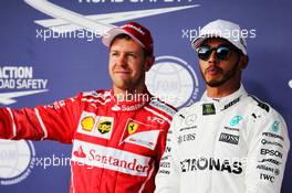 (L to R): Sebastian Vettel (GER) Ferrari with pole sitter Lewis Hamilton (GBR) Mercedes AMG F1 in qualifying parc ferme. 21.10.2017. Formula 1 World Championship, Rd 17, United States Grand Prix, Austin, Texas, USA, Qualifying Day.