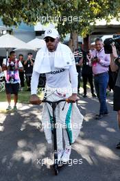 Lewis Hamilton (GBR) Mercedes AMG F1 on a scooter in the paddock. 23.03.2018. Formula 1 World Championship, Rd 1, Australian Grand Prix, Albert Park, Melbourne, Australia, Practice Day.