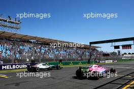 Lewis Hamilton (GBR) Mercedes AMG F1 W09 and Esteban Ocon (FRA) Sahara Force India F1 VJM11 practice a start. 23.03.2018. Formula 1 World Championship, Rd 1, Australian Grand Prix, Albert Park, Melbourne, Australia, Practice Day.