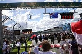 A plane flies over the grid as it observes the national anthem. 25.03.2018. Formula 1 World Championship, Rd 1, Australian Grand Prix, Albert Park, Melbourne, Australia, Race Day.