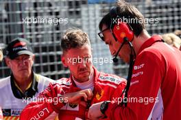 (L to R): Sebastian Vettel (GER) Ferrari with Riccardo Adami (ITA) Ferrari Race Engineer on the grid. 25.03.2018. Formula 1 World Championship, Rd 1, Australian Grand Prix, Albert Park, Melbourne, Australia, Race Day.