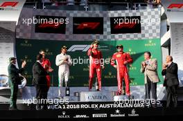 The podium (L to R): Lewis Hamilton (GBR) Mercedes AMG F1, second; Sebastian Vettel (GER) Ferrari, race winner; Kimi Raikkonen (FIN) Ferrari, third. 25.03.2018. Formula 1 World Championship, Rd 1, Australian Grand Prix, Albert Park, Melbourne, Australia, Race Day.