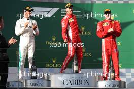 1st place Sebastian Vettel (GER) Ferrari SF71H with 2nd place Lewis Hamilton (GBR) Mercedes AMG F1 W09 and 3rd place Kimi Raikkonen (FIN) Ferrari SF71H. 25.03.2018. Formula 1 World Championship, Rd 1, Australian Grand Prix, Albert Park, Melbourne, Australia, Race Day.