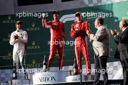 The podium (L to R): Lewis Hamilton (GBR) Mercedes AMG F1, second; Sebastian Vettel (GER) Ferrari, race winner; Kimi Raikkonen (FIN) Ferrari, third. 25.03.2018. Formula 1 World Championship, Rd 1, Australian Grand Prix, Albert Park, Melbourne, Australia, Race Day.