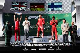 The podium (L to R): Lewis Hamilton (GBR) Mercedes AMG F1, second; Sebastian Vettel (GER) Ferrari, race winner; Kimi Raikkonen (FIN) Ferrari, third. 25.03.2018. Formula 1 World Championship, Rd 1, Australian Grand Prix, Albert Park, Melbourne, Australia, Race Day.