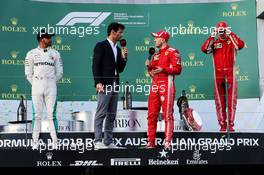 The podium (L to R): Lewis Hamilton (GBR) Mercedes AMG F1, second; Mark Webber (AUS) Channel 4 Presenter; Sebastian Vettel (GER) Ferrari, race winner; Kimi Raikkonen (FIN) Ferrari, third. 25.03.2018. Formula 1 World Championship, Rd 1, Australian Grand Prix, Albert Park, Melbourne, Australia, Race Day.