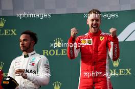 Race winner Sebastian Vettel (GER) Ferrari (Right) celebrates on the podium alongside second placed Lewis Hamilton (GBR) Mercedes AMG F1 (Left). 25.03.2018. Formula 1 World Championship, Rd 1, Australian Grand Prix, Albert Park, Melbourne, Australia, Race Day.