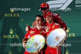 Inaki Rueda (ESP) Ferrari Race Strategist (Left) celebrates on the podium with race winner Sebastian Vettel (GER) Ferrari (Right) and third placed Kimi Raikkonen (FIN) Ferrari (Centre). 25.03.2018. Formula 1 World Championship, Rd 1, Australian Grand Prix, Albert Park, Melbourne, Australia, Race Day.