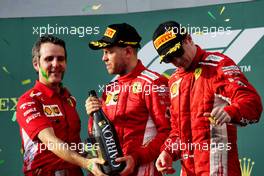 (L to R): Inaki Rueda (ESP) Ferrari Race Strategist celebrates on the podium with race winner Sebastian Vettel (GER) Ferrari and third placed Kimi Raikkonen (FIN) Ferrari. 25.03.2018. Formula 1 World Championship, Rd 1, Australian Grand Prix, Albert Park, Melbourne, Australia, Race Day.