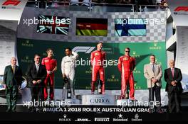 The podium (L to R): Lewis Hamilton (GBR) Mercedes AMG F1, second; Sebastian Vettel (GER) Ferrari, race winner; Kimi Raikkonen (FIN) Ferrari, third. 25.03.2018. Formula 1 World Championship, Rd 1, Australian Grand Prix, Albert Park, Melbourne, Australia, Race Day.