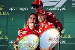 Inaki Rueda (ESP) Ferrari Race Strategist (Left) celebrates on the podium with race winner Sebastian Vettel (GER) Ferrari (Right) and third placed Kimi Raikkonen (FIN) Ferrari (Centre). 25.03.2018. Formula 1 World Championship, Rd 1, Australian Grand Prix, Albert Park, Melbourne, Australia, Race Day.