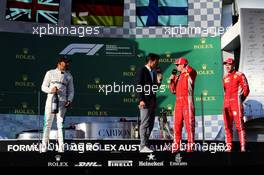 The podium (L to R): Lewis Hamilton (GBR) Mercedes AMG F1, second; Mark Webber (AUS) Channel 4 Presenter; Sebastian Vettel (GER) Ferrari, race winner; Kimi Raikkonen (FIN) Ferrari, third. 25.03.2018. Formula 1 World Championship, Rd 1, Australian Grand Prix, Albert Park, Melbourne, Australia, Race Day.