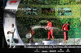 The podium (L to R): Lewis Hamilton (GBR) Mercedes AMG F1, second; Sebastian Vettel (GER) Ferrari, race winner; Kimi Raikkonen (FIN) Ferrari, third. 25.03.2018. Formula 1 World Championship, Rd 1, Australian Grand Prix, Albert Park, Melbourne, Australia, Race Day.