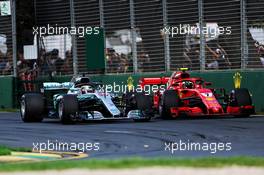 (L to R): Lewis Hamilton (GBR) Mercedes AMG F1 W09 and Kimi Raikkonen (FIN) Ferrari SF71H at the start of the race. 25.03.2018. Formula 1 World Championship, Rd 1, Australian Grand Prix, Albert Park, Melbourne, Australia, Race Day.