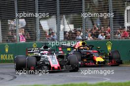 Romain Grosjean (FRA) Haas F1 Team VF-18 and Daniel Ricciardo (AUS) Red Bull Racing RB14 battle for position. 25.03.2018. Formula 1 World Championship, Rd 1, Australian Grand Prix, Albert Park, Melbourne, Australia, Race Day.
