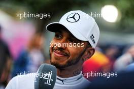 Lewis Hamilton (GBR) Mercedes AMG F1 with the media. 24.03.2018. Formula 1 World Championship, Rd 1, Australian Grand Prix, Albert Park, Melbourne, Australia, Qualifying Day.