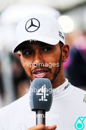 Lewis Hamilton (GBR) Mercedes AMG F1 with the media. 24.03.2018. Formula 1 World Championship, Rd 1, Australian Grand Prix, Albert Park, Melbourne, Australia, Qualifying Day.