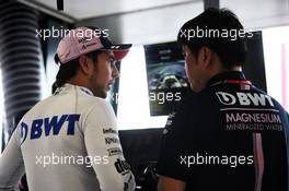 (L to R): Sergio Perez (MEX) Sahara Force India F1 with Jun Matsuzaki (JPN) Sahara Force India F1 Team Senior Tyre Engineer. 24.03.2018. Formula 1 World Championship, Rd 1, Australian Grand Prix, Albert Park, Melbourne, Australia, Qualifying Day.