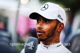 Lewis Hamilton (GBR) Mercedes AMG F1 with the media. 24.03.2018. Formula 1 World Championship, Rd 1, Australian Grand Prix, Albert Park, Melbourne, Australia, Qualifying Day.