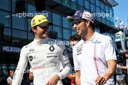 (L to R): Carlos Sainz Jr (ESP) Renault Sport F1 Team with Sergio Perez (MEX) Sahara Force India F1 on the drivers parade. 25.03.2018. Formula 1 World Championship, Rd 1, Australian Grand Prix, Albert Park, Melbourne, Australia, Race Day.