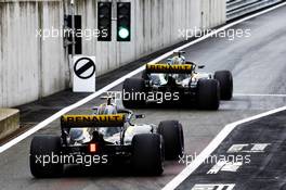 Nico Hulkenberg (GER) Renault Sport F1 Team RS18 leads team mate Carlos Sainz Jr (ESP) Renault Sport F1 Team RS18 out of the pits. 29.06.2018. Formula 1 World Championship, Rd 9, Austrian Grand Prix, Spielberg, Austria, Practice Day.